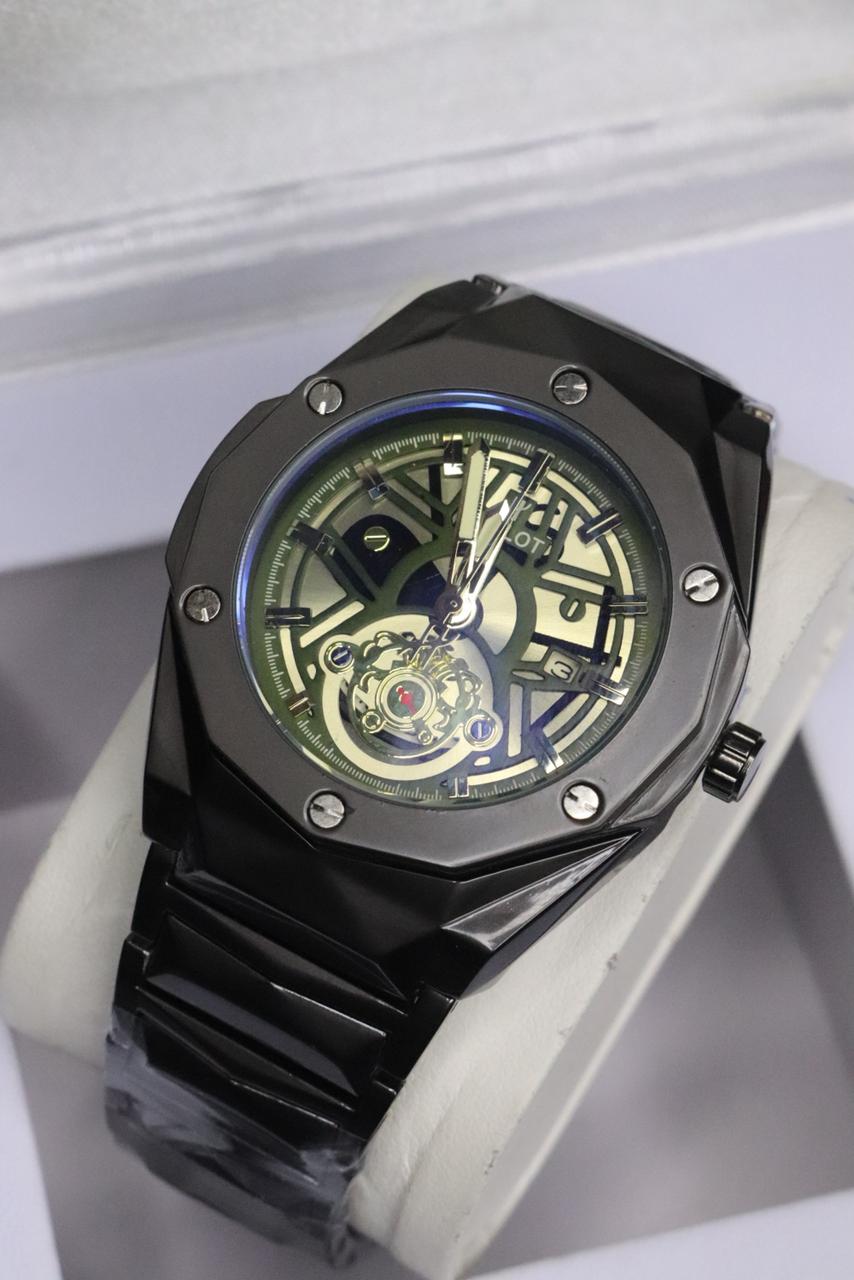 Black mechanical watch with a detailed face on a white background