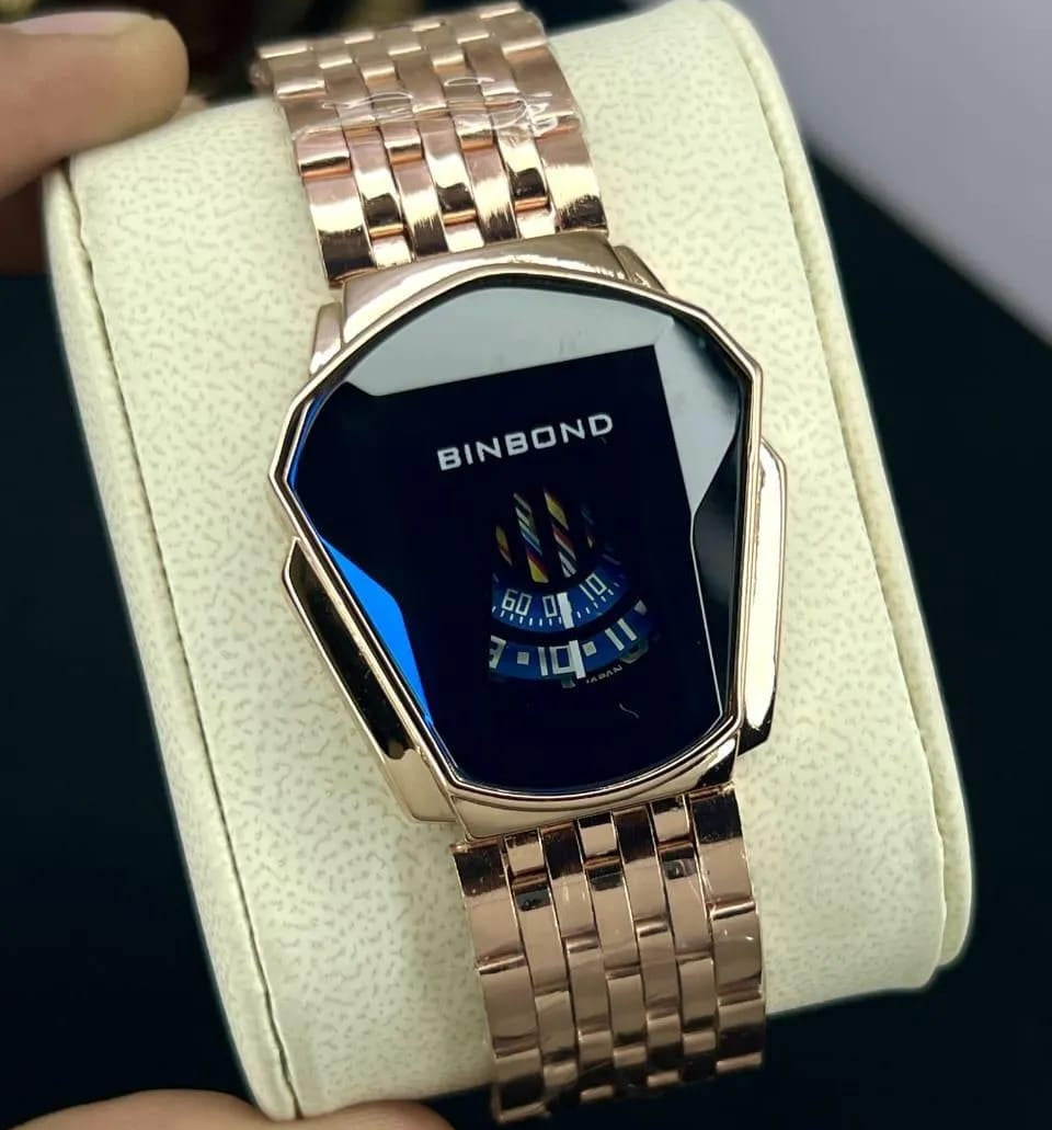Rose gold digital watch with 'BINBOND' branding on a white cushion