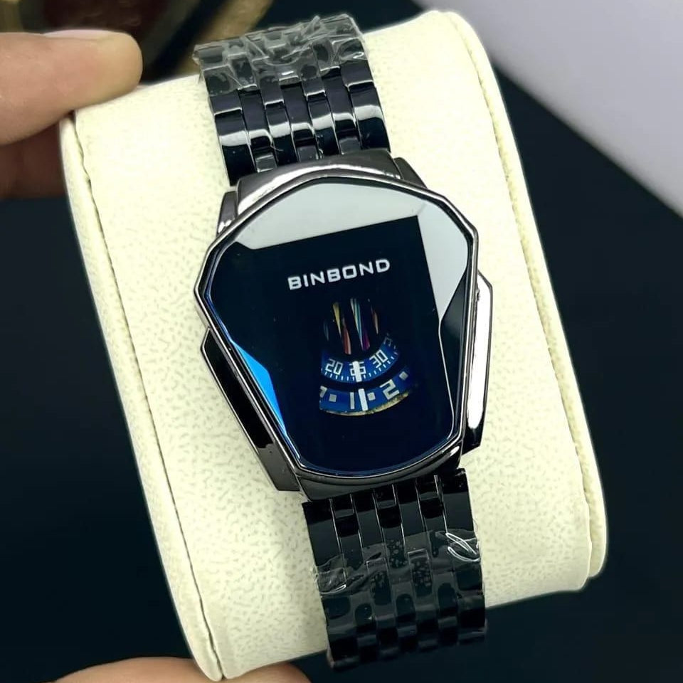 Binbond digital watch with a metal band on a white cushion