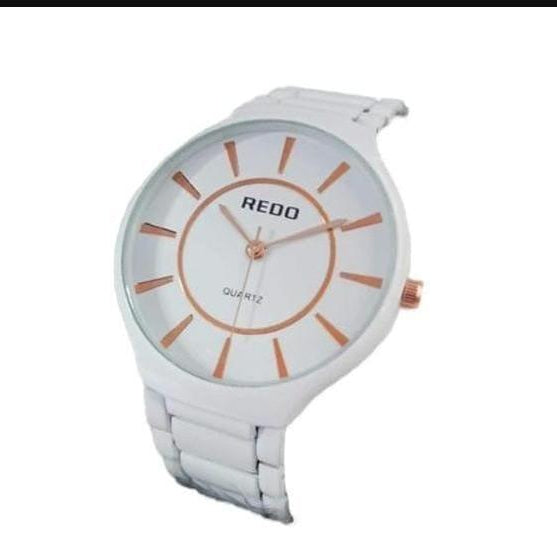White watch with rose gold accents on a white background