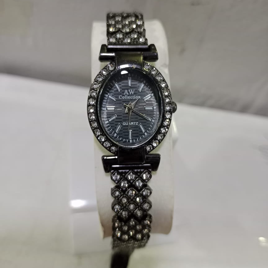 Watch with decorative band on a white stand