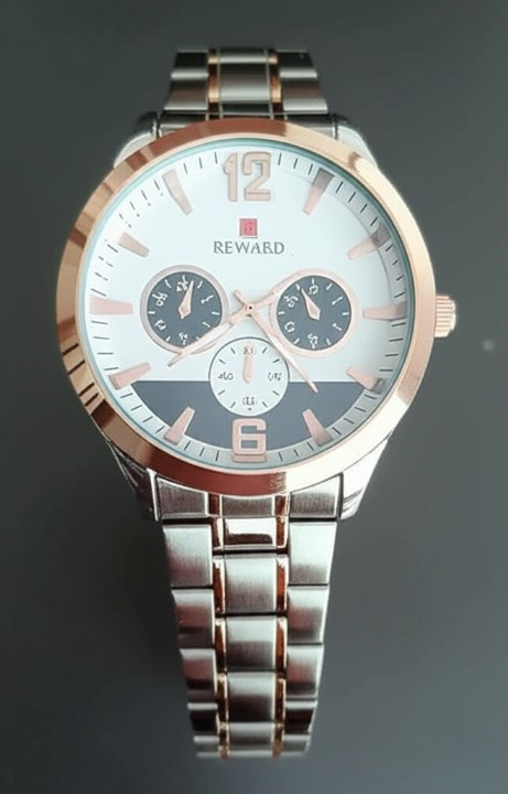 Silver and rose gold watch with a dark background
