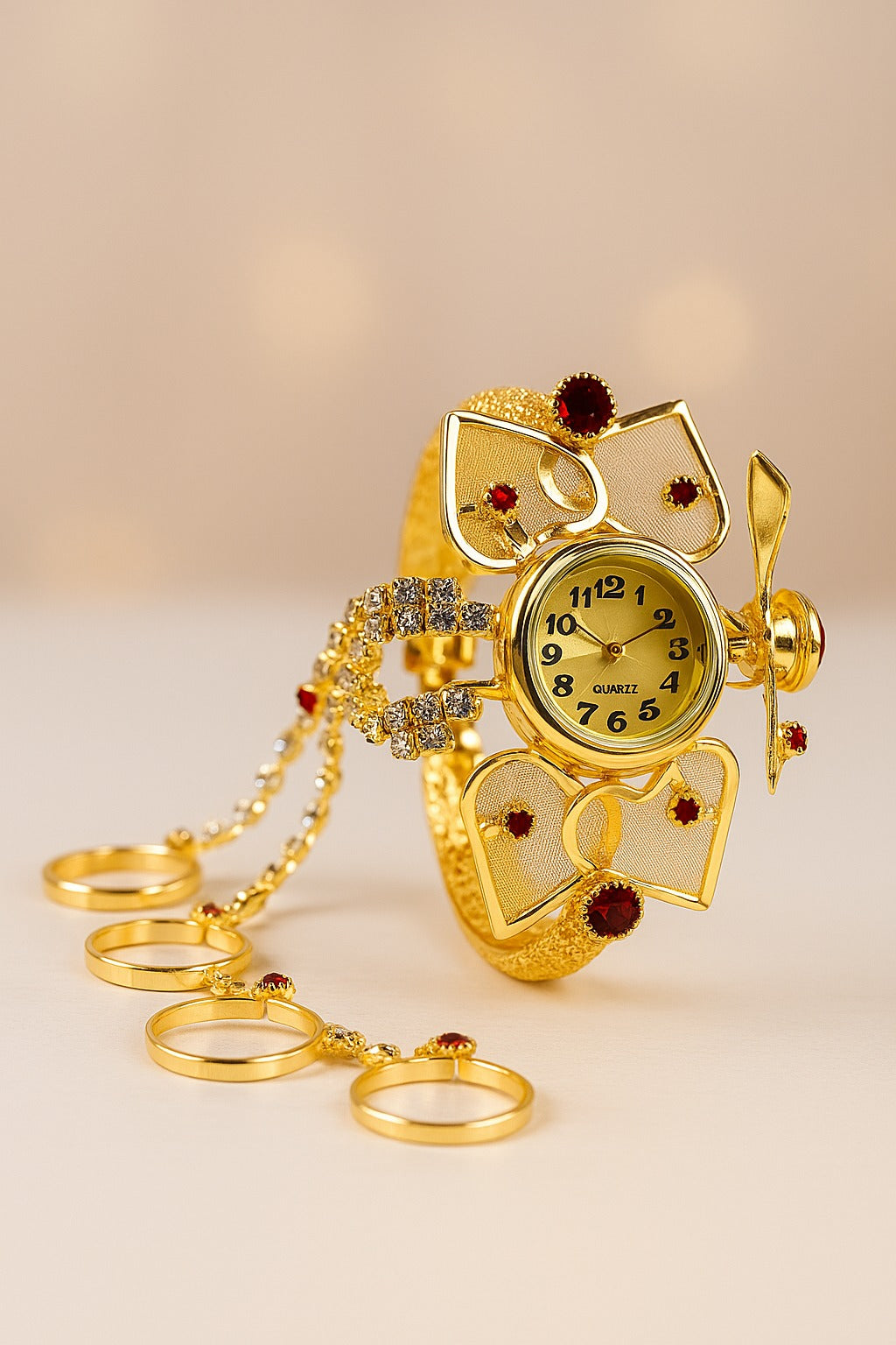 Gold owl-shaped watch with decorative elements on a beige background