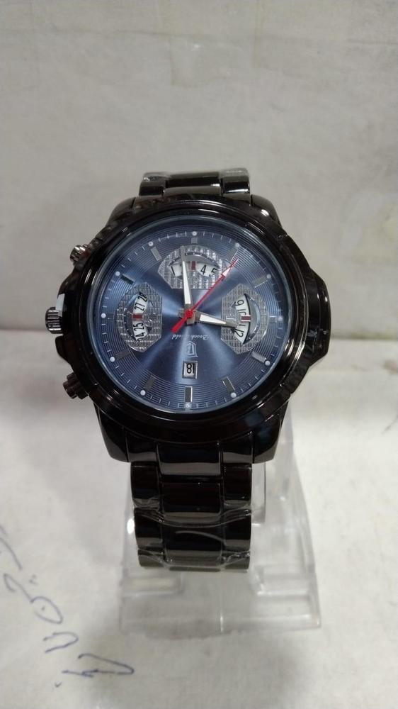 Black wristwatch with a blue face on a light gray background