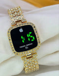 Gold-framed digital watch with Apple logo on a white surface