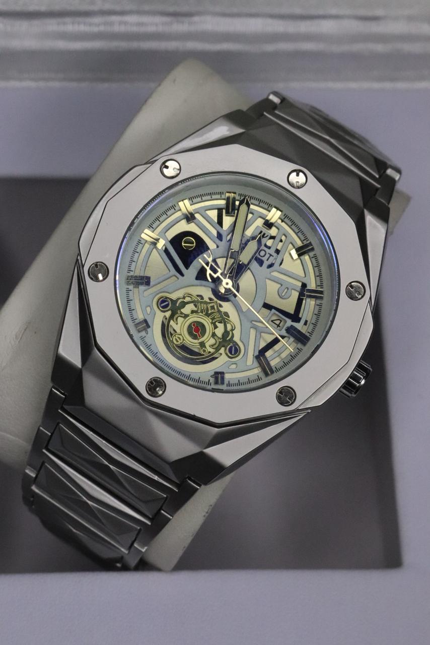 Luxury watch with a detailed face on a gray background