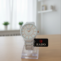 Rado watch on a stand with a blurred background