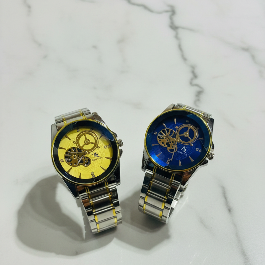 Two watches with yellow and blue faces on a marble surface