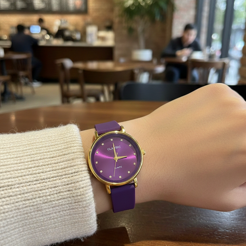 Person wearing a purple and gold watch in a casual setting